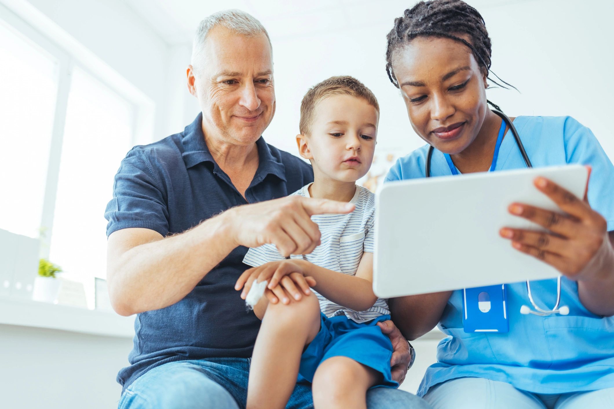 Doctor speaking with patients in a medical office