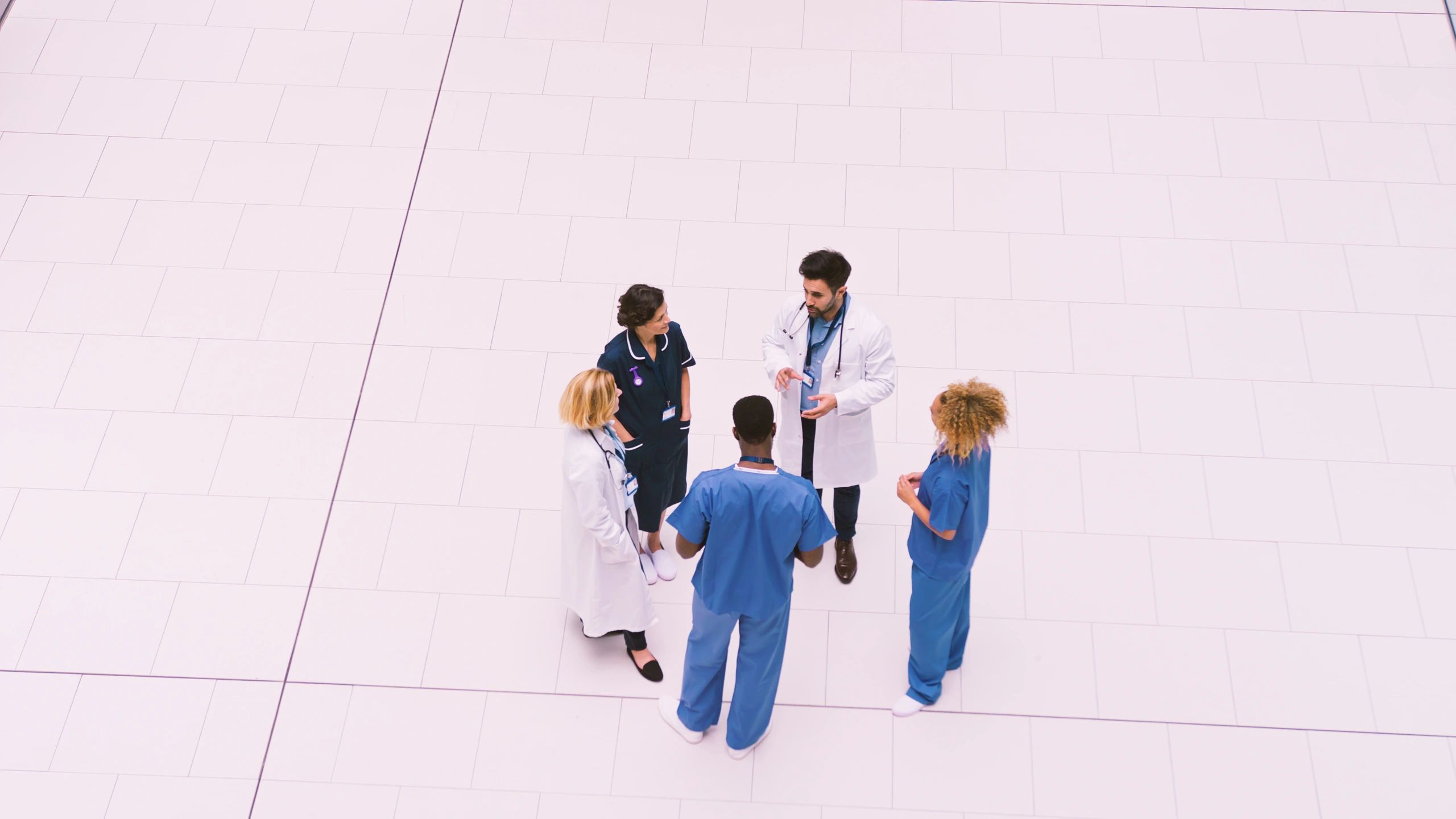 Healthcare professionals collaborating in a hospital meeting area