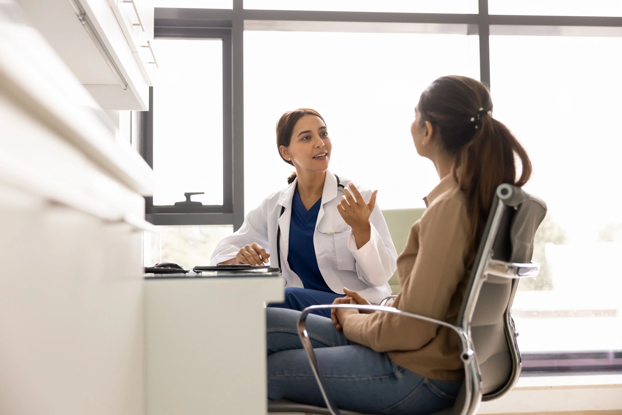 Doctor consulting with a patient in a professional clinic office